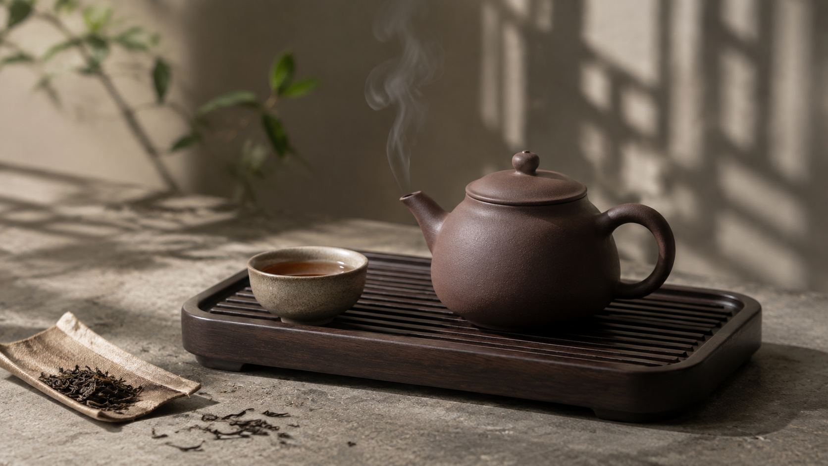 Handmade Yixing Zisha teapot in natural purple-brown clay beside a Gongfu tea tray